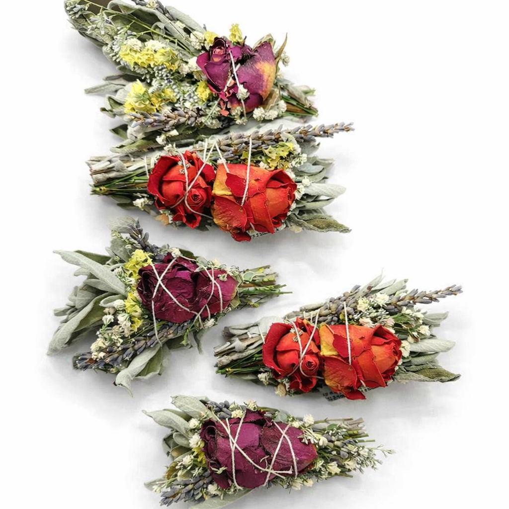 Four floral arrangements with red and pink flowers on a white background
- Clover's Charm