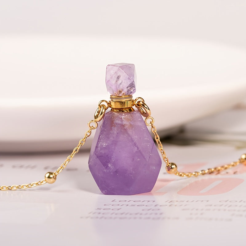 Purple natural crystal perfume bottle and chain sitting on a magazine page.