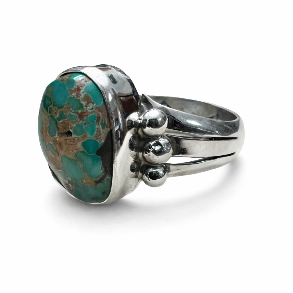 Natural Sterling Silver ring with a large Royston turquoise stone on a white background