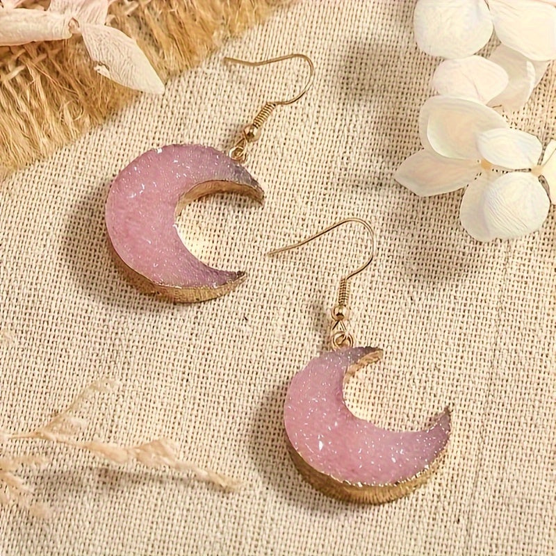 Pink Moonstone Crescent Earrings – Gold‑Trim Dangle Earrings for Women, Coquette & Boho Style displayed on a beige background