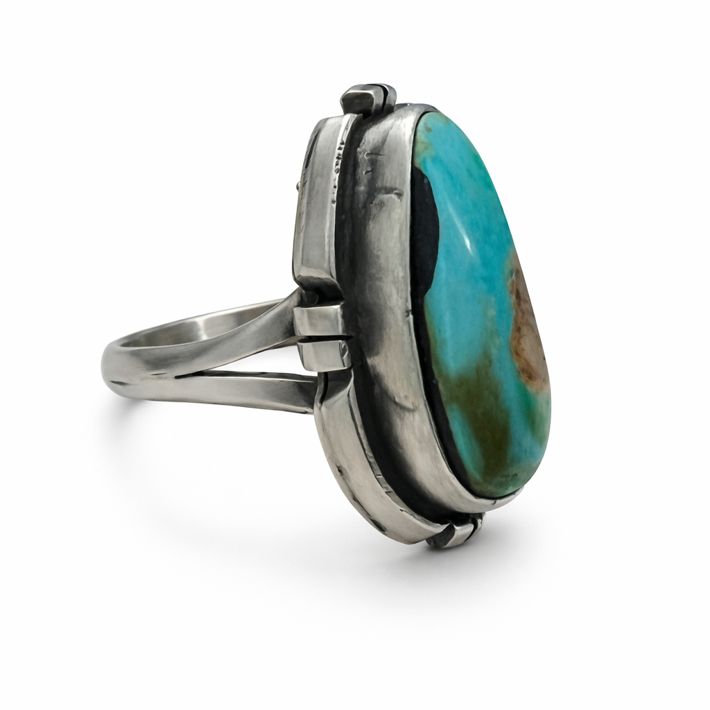 Sterling Silver Randy Billy ring with a large turquoise stone on a white background