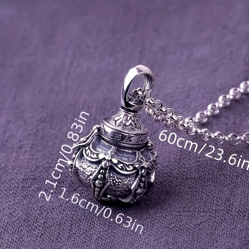 Retro metal gawu box pendant necklace showing size reference on a purple textured surface.