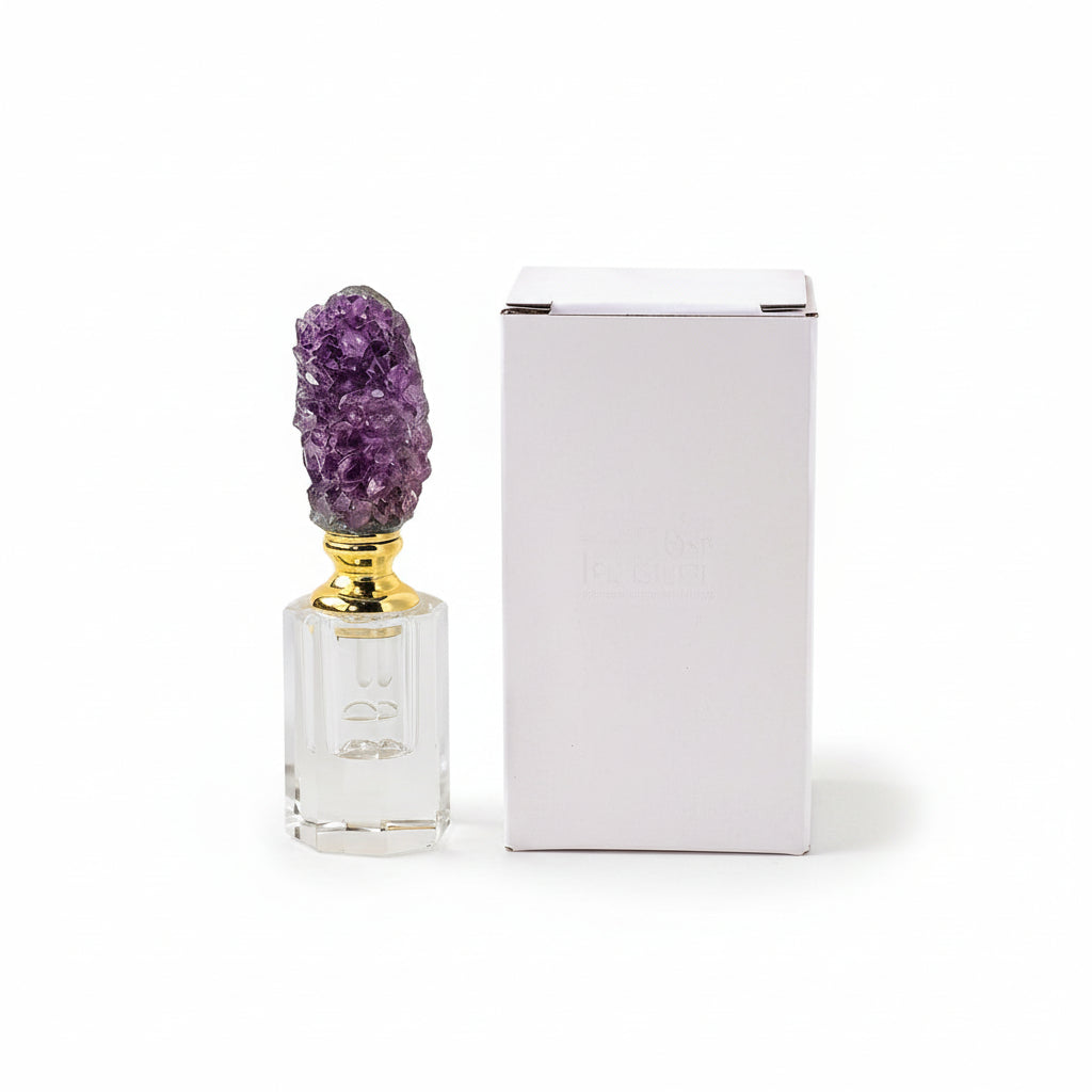 RUNYANGSHI vintage-inspired rectangle crystal perfume bottle with amethyst cluster stopper sitting next to packaging on a white
background.