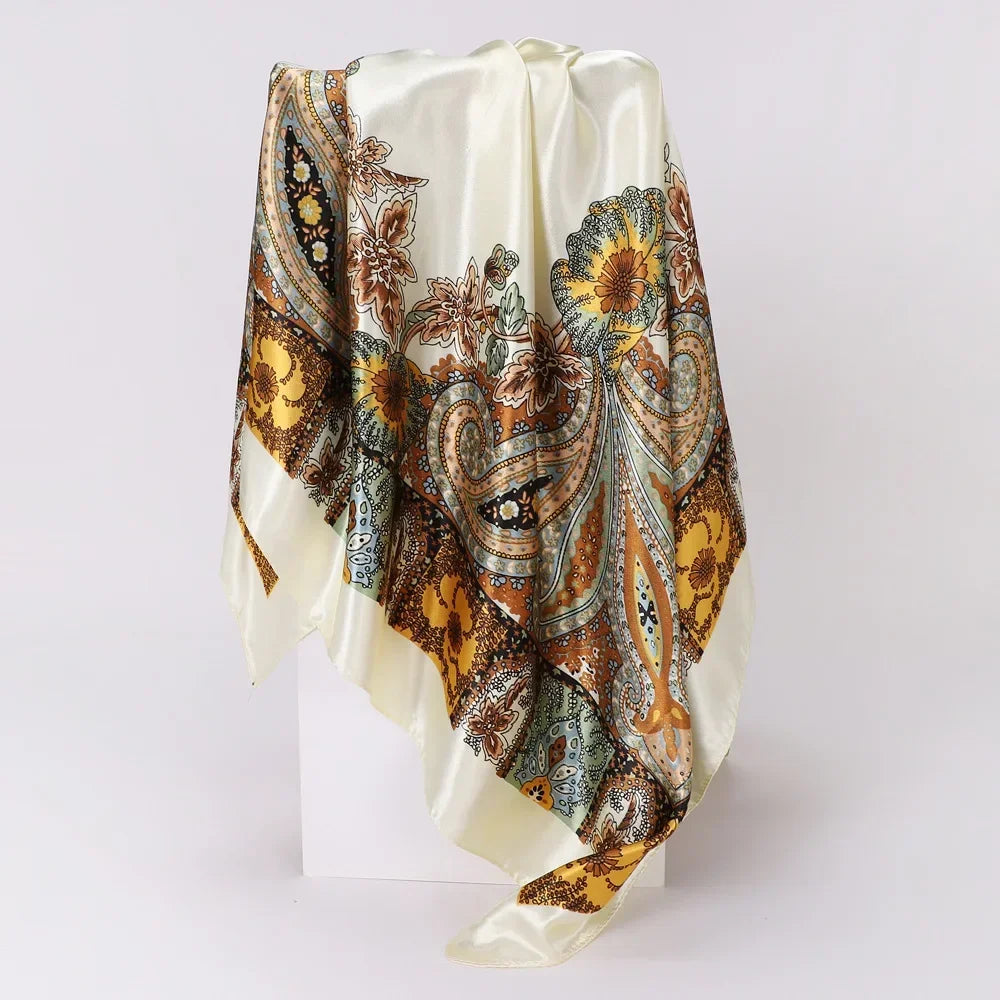 Decorative white scarf with paisley and floral patterns on a white background