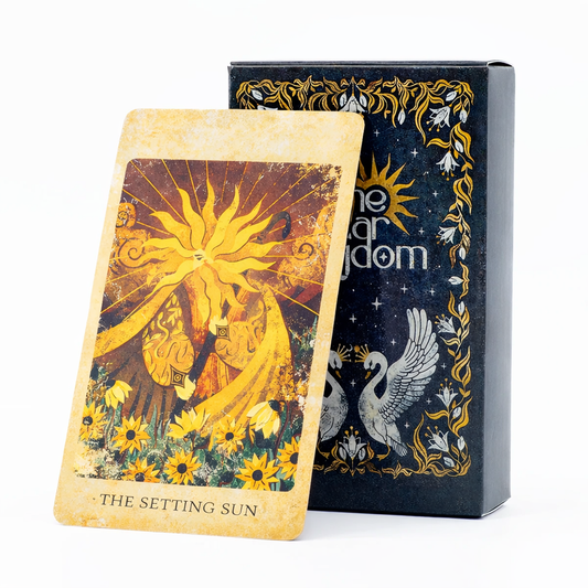 Tarot card with 'The Setting Sun' design and tarot card box featuring celestial imagery.