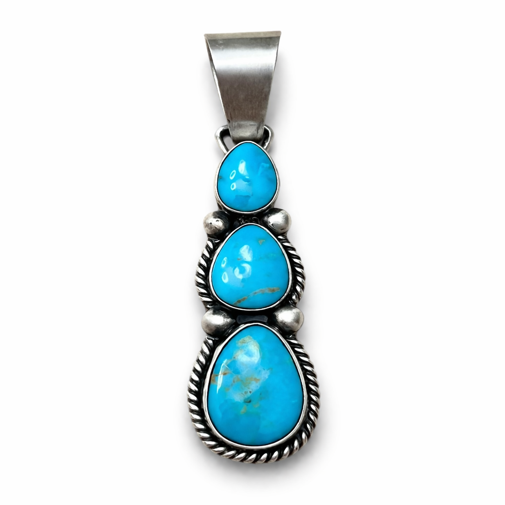 Sonoran Turquoise pendant with sterling silver setting on a white background. -Clover's Charm