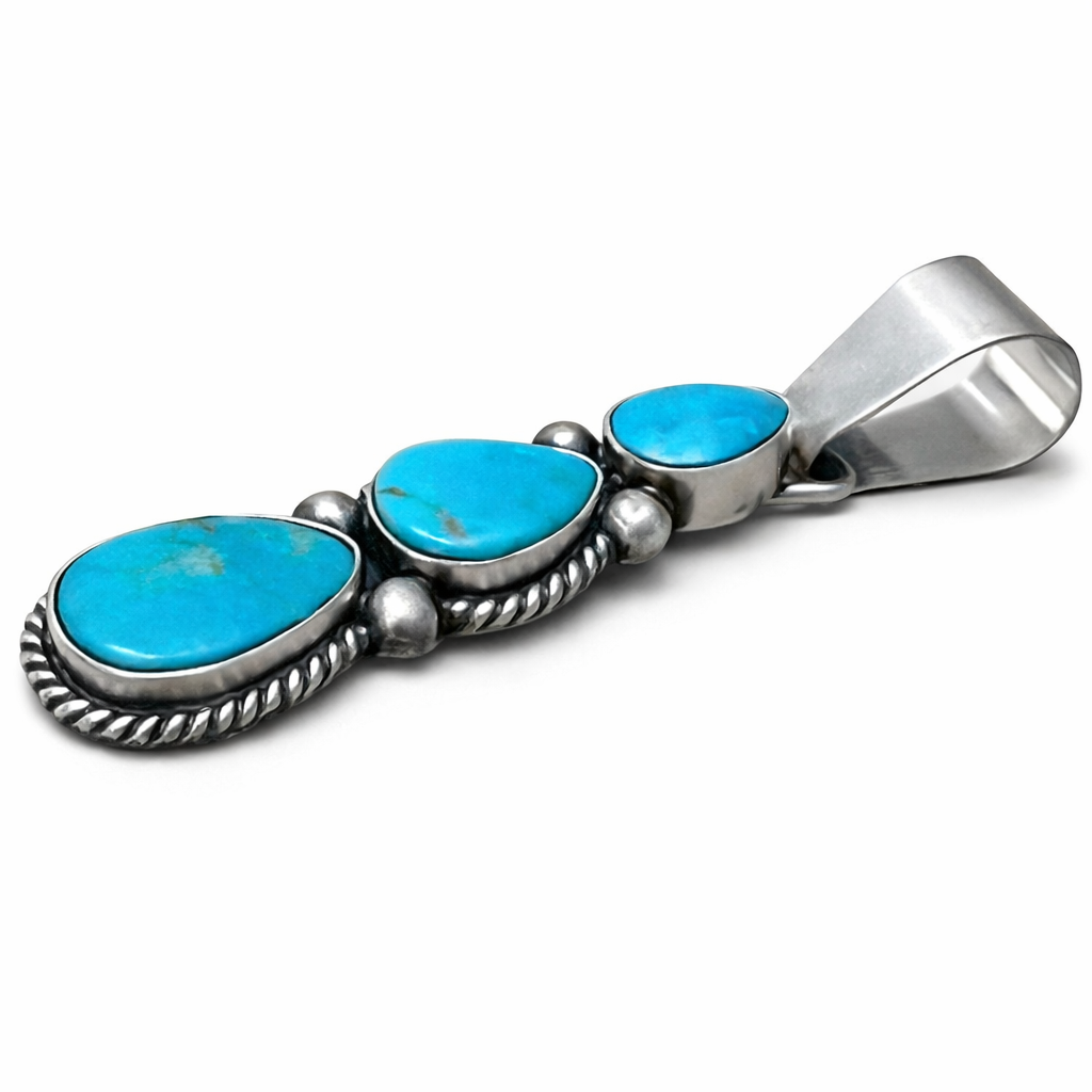 Sterling Silver pendant with Sonoran turquoise stones on a white background. -Clover's Charm