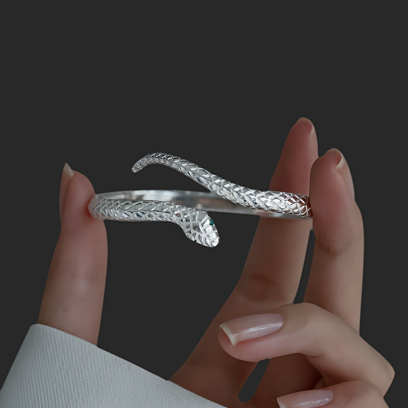 925 Silver Snake Bracelet with Cubic Zirconia being held between fingers