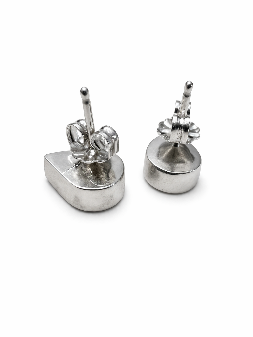 Pair of silver earrings on a white background