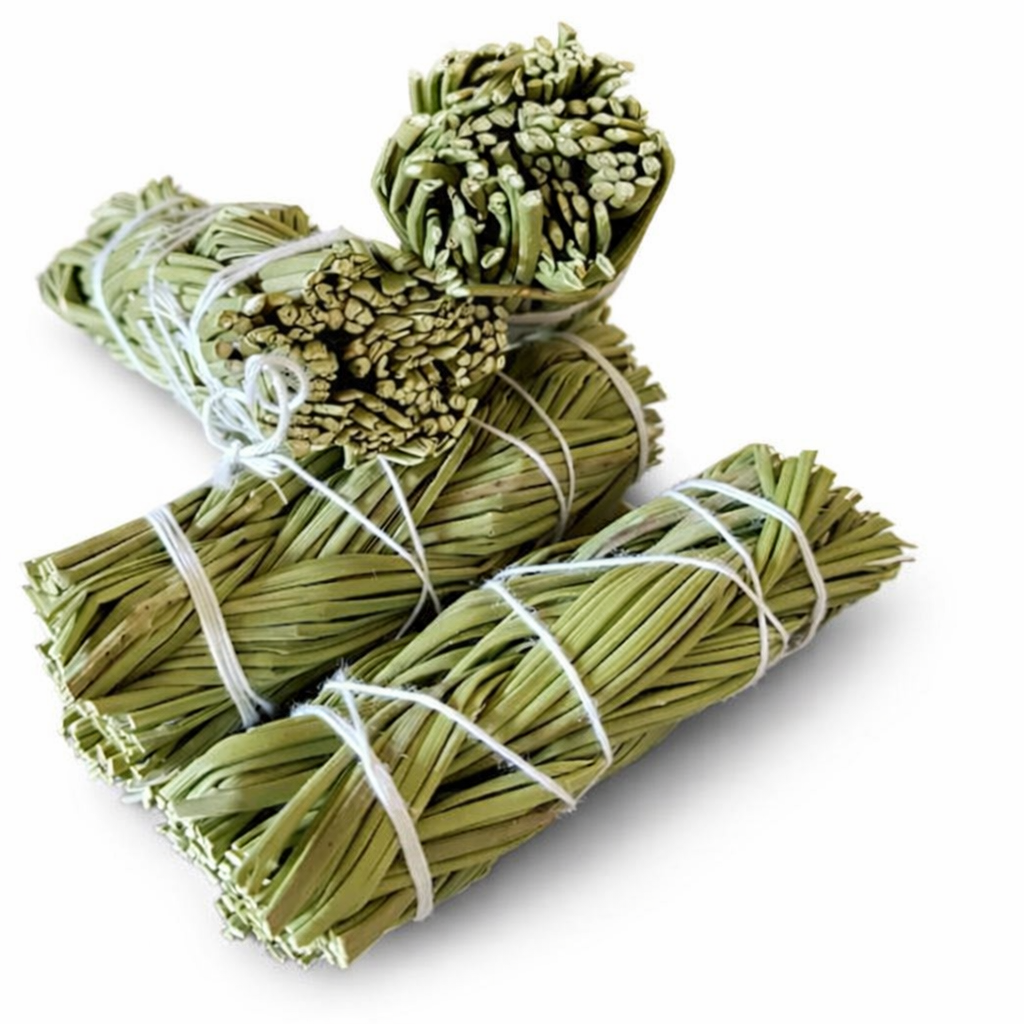 Bundles of sweetgrass tied with twine on a white background. -Clover's Charm