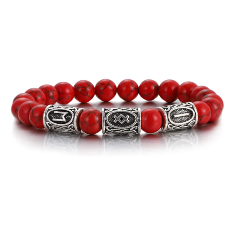 Red beaded bracelet with silver metal clasp on a white background