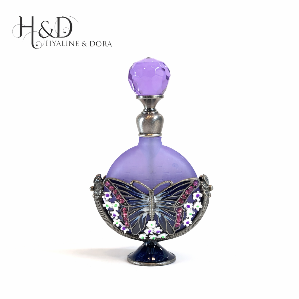Decorative purple perfume bottle with butterfly design and 'Hyaline & Dora' branding.