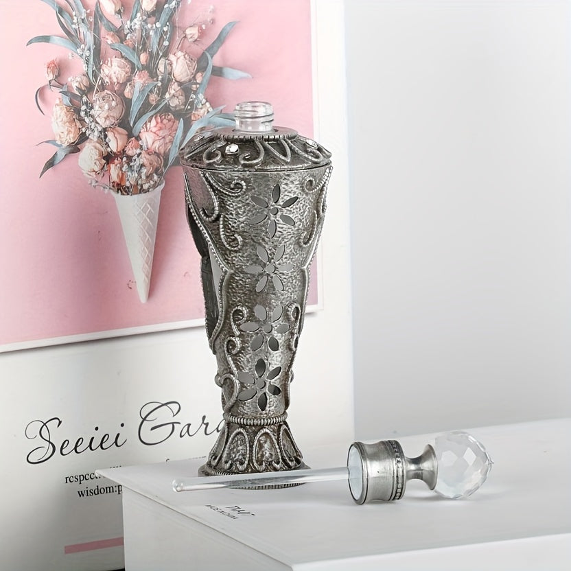 Vintage inspired decorative perfume bottle shown open with glass applicator and ornate detailing.
