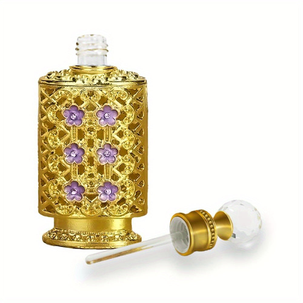 Vintage inspired gold filigree perfume bottle open showing glass rod
on a white background.