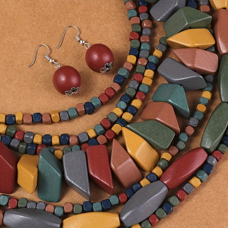 Colorful bead necklace and earrings on a wooden surface
