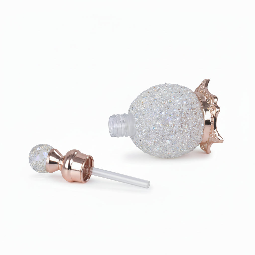 Vintage style rhinestone glass perfume bottle showing refillable dropper opening
