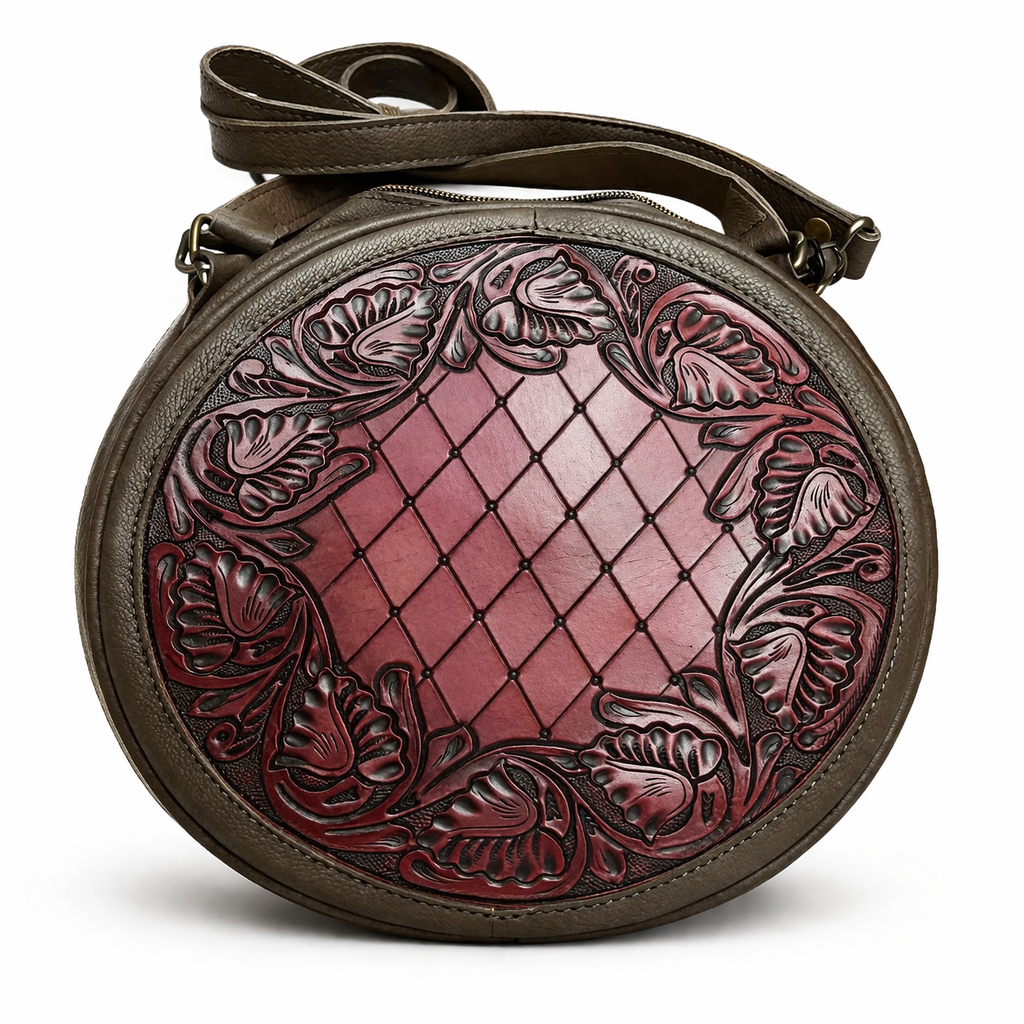 Round leather bag with intricate designs on a white background