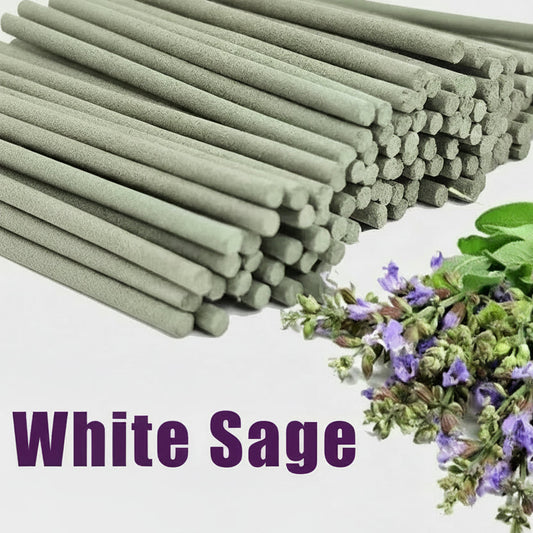 White sage incense sticks with a small bundle of white sage leaves and flowers on a light background.