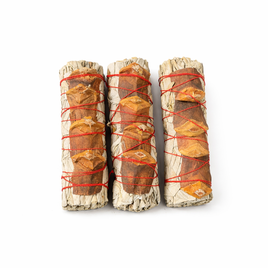 Three sage & pine smudge sticks wrapped with red string on a white background - Clover's Charm