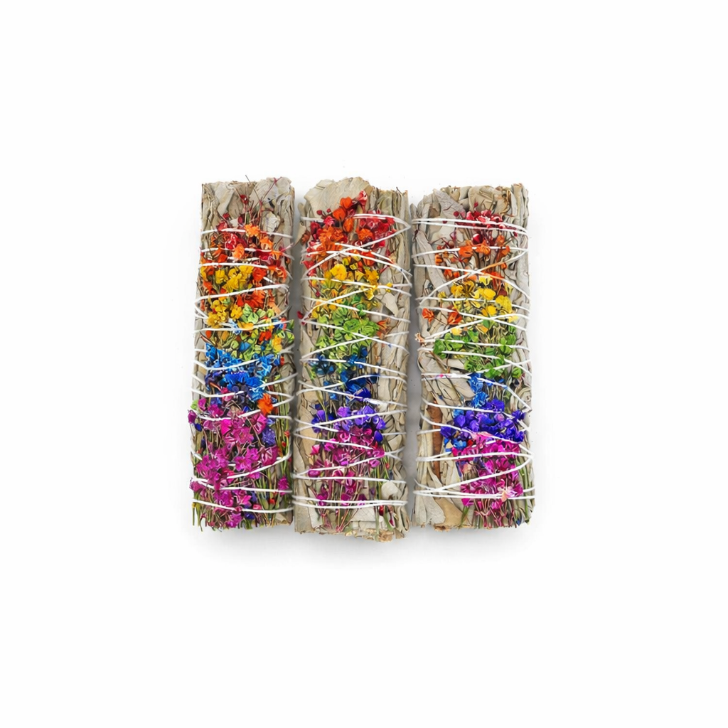 Three bundles of colorful flowers wrapped in twine on a white background - Clover's Charm