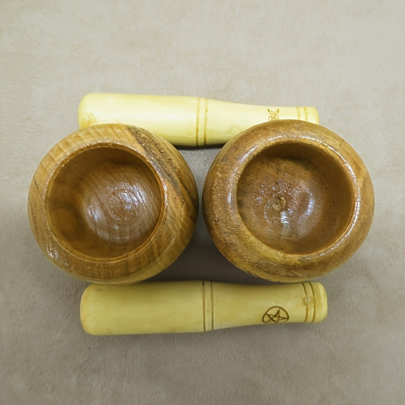 the top down view of two upright mortars and their pestles on their sides.