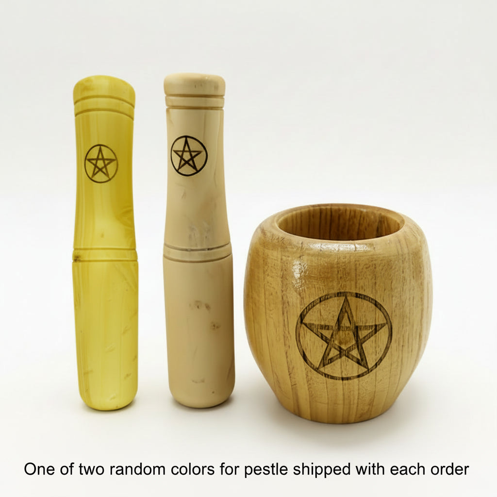Two wooden pestles with pentacle icons and a wooden bowl with pentacle icon on a white background. With disclaimer "One of two random colors for pestle shipped with each order"